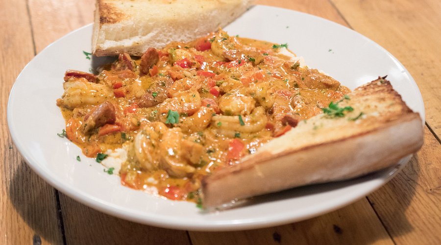 Papa's Famous Shrimp and Grits — fresh Gulf shrimp over creamy cheddar grits
